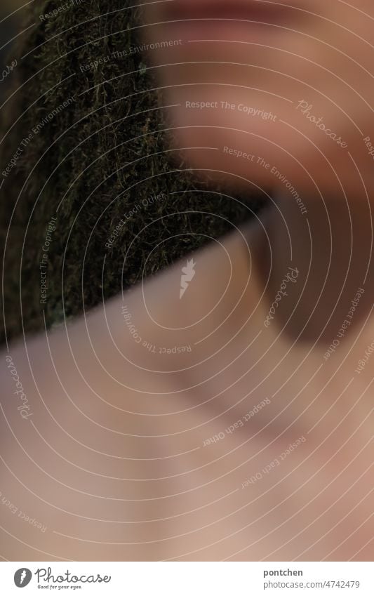 Blurred body parts of a woman in front of a tree trunk. Nature connection. Chin, mouth, shoulder, collarbone Woman Body close to nature naturally Collarbone