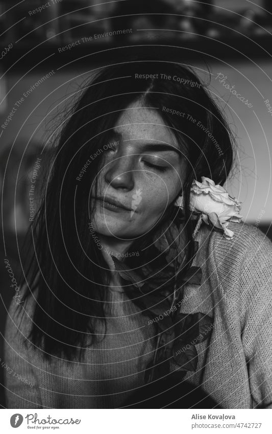 portrait of a girl with a white rose selfportraits black and white portrait photography Closed eyes dark hair flower Young woman person messy hair face