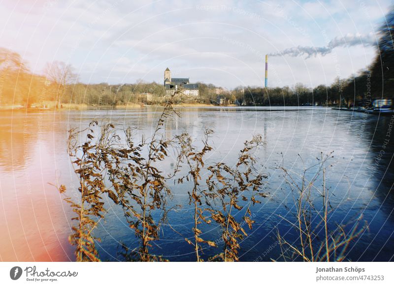 View over castle pond with forge and castle church, Chemnitz fossil fuels Fossil Energy Dirty movie Raw vintage Coal power station Grain lightleak Analog Retro