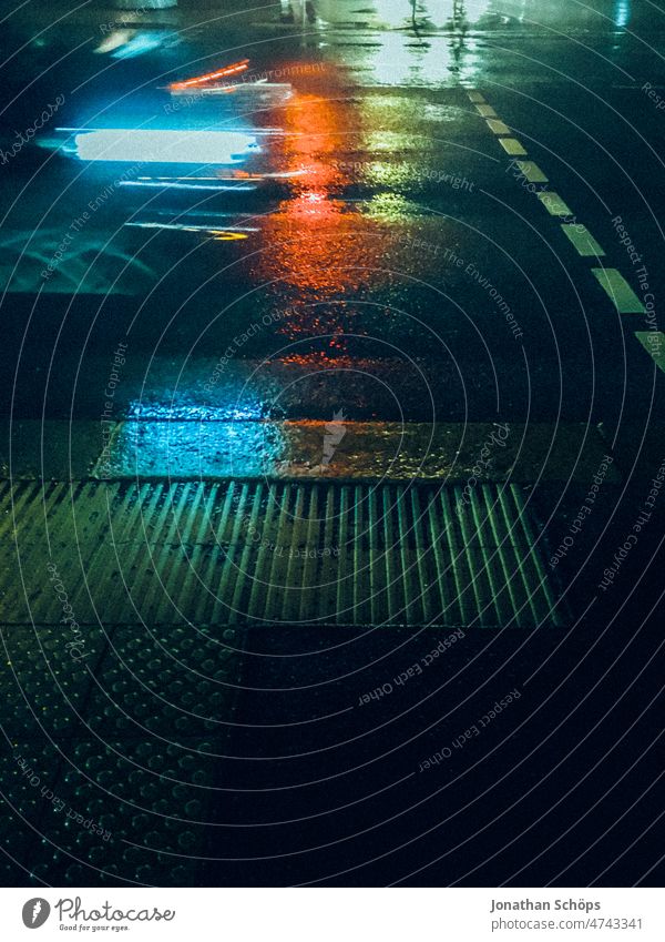 Street at night and rain with colorful lights Reflection Night Rain Wet clearer variegated urban city Town Chemnitz Capital of Culture 2025