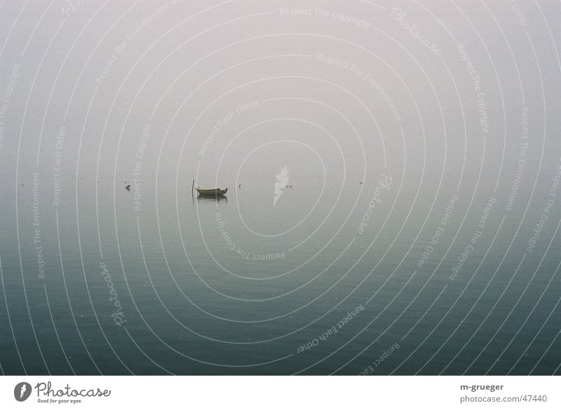 Lonely rowing boat Rowboat Dinghy Fog Hiddensee Calm Loneliness