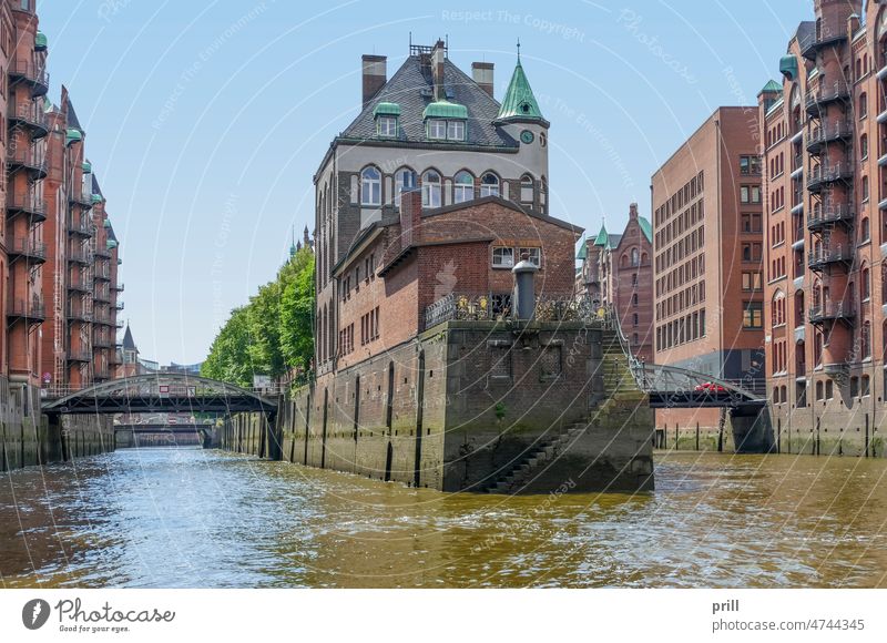 Speicherstadt in Hamburg storehouse city warehouse district Germany old historic Port City canal bridge facade House facade brick Brick wall port of hamburg