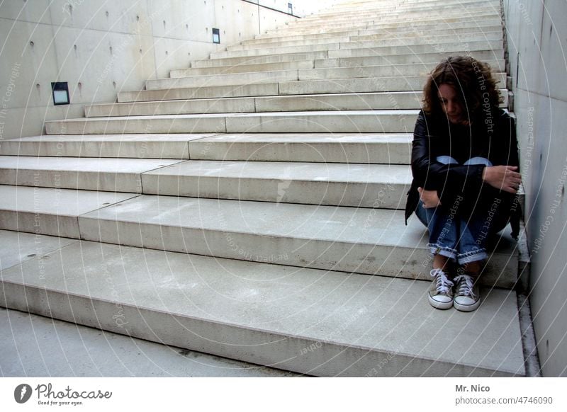 be alone Sit Distress Longing Loneliness Exhaustion Concern Sadness Calm Stairs Manmade structures Woman Feminine Pain Modern architecture Upward Downward