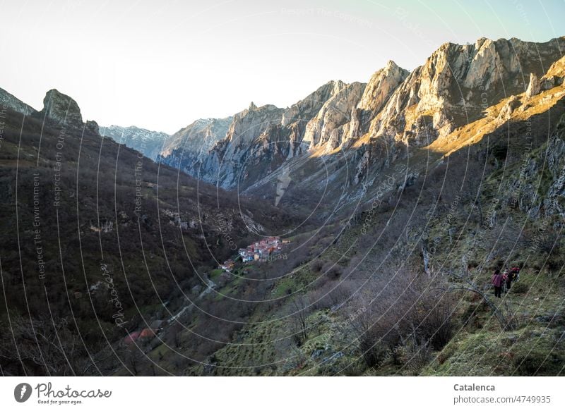 Hidden away lies the mountain village . Nature Landscape mountains Peak Environment Rock Mountain Sky Beautiful weather Day daylight plants vegetation bushes