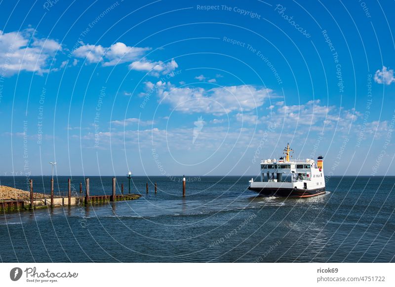 Ferry boat in port Nordstrand on the North Sea coast Nordstrand island ship Schleswig-Holstein Mooring post voyage vacation Harbour Ferry terminal destination