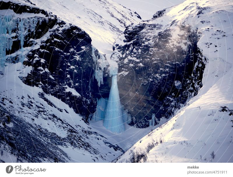 Sugar cone shaped ice fall amid heart shaped rock wall Waterfall Icefall Winter Nature River Rock Landscape Frozen Snow Frost Cold ossified Heart mountain