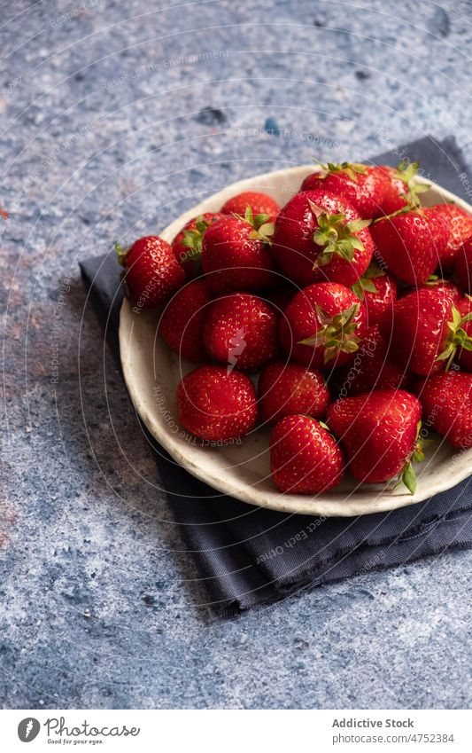 Plate with fresh strawberries on napkin strawberry plate ripe table bunch marble organic folded natural cloth vitamin vegan vegetarian fruit ingredient sweet