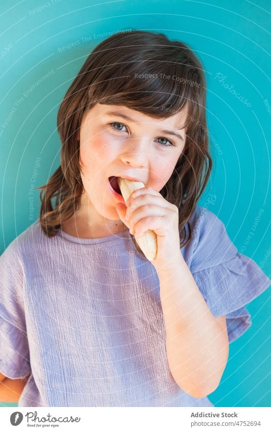 Girl eating ripe banana girl kid childhood fruit organic healthy food natural fresh sweet studio appearance vitamin cute mood hungry tasty pleasant colorful