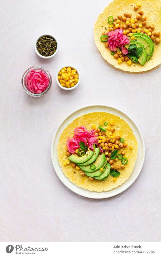 Fresh tortillas with various toppings taco mexican filling avocado chickpea traditional food kitchen culinary ingredient nutrition tasty delicious table fresh