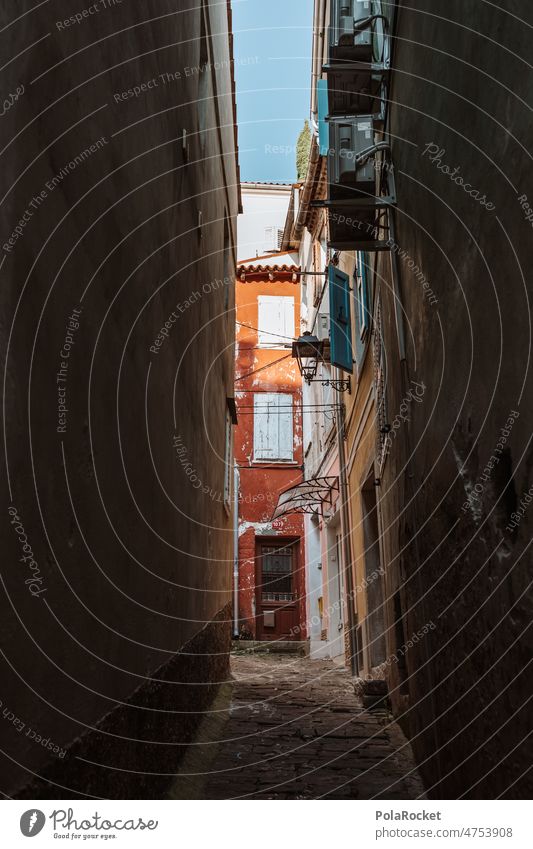 #A0# Alley with red lanes gaseous muck romance of the streets popular piran Slovenia Mediterranean angled