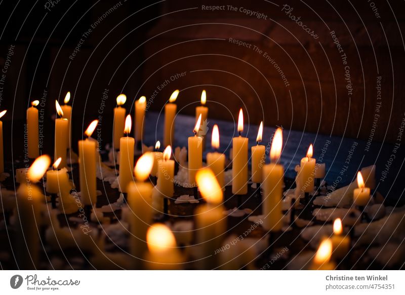 Pausing / candles in a church for Good Friday Sacrificial Lights Sacrificial candles Candle altar Religion and faith Hope Belief shoulder stand Church