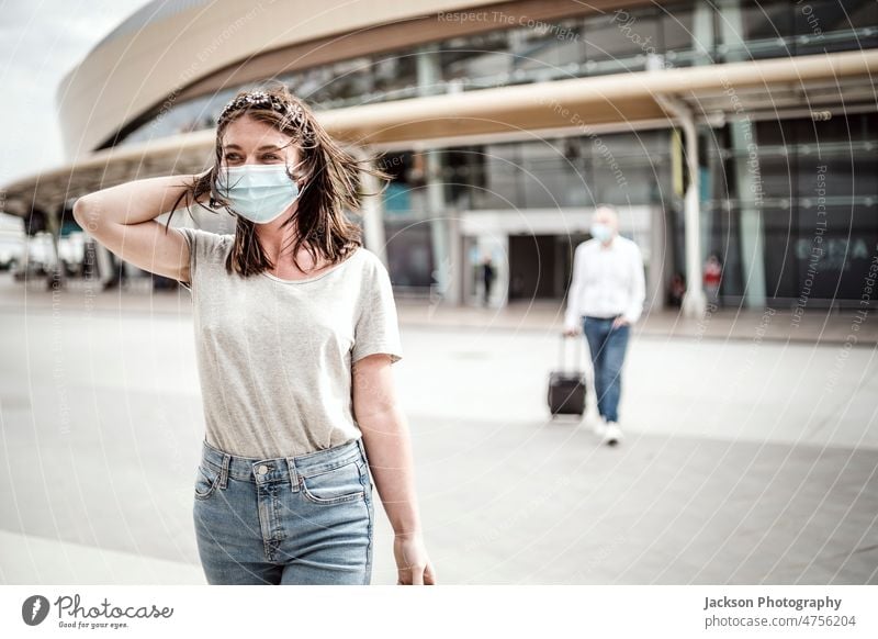 A young woman leaving the airport with her luggage at her destination traveller bag explore check relax smile attractive fly modern arrival lifestyle caucasian