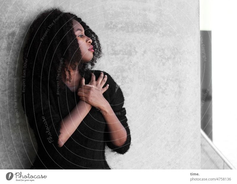 Woman with hands crossed portrait Profile Curl Dark-haired Sweater Wall (barrier) Arm Interlocked Stand Wall (building) Earnest Forward Feminine Long-haired