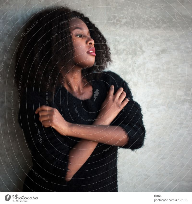 Woman with arms crossed portrait Profile Curl Dark-haired Sweater Wall (barrier) Arm hands Interlocked Stand Wall (building) Earnest Forward Feminine