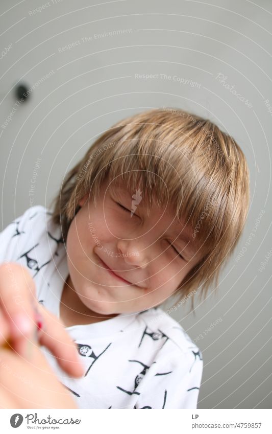 boy with closed eyes Joy Accessory Kindergarten real people Smiling Children's game Leisure and hobbies Optimism Close-up Love Connection Positive Innocent fun