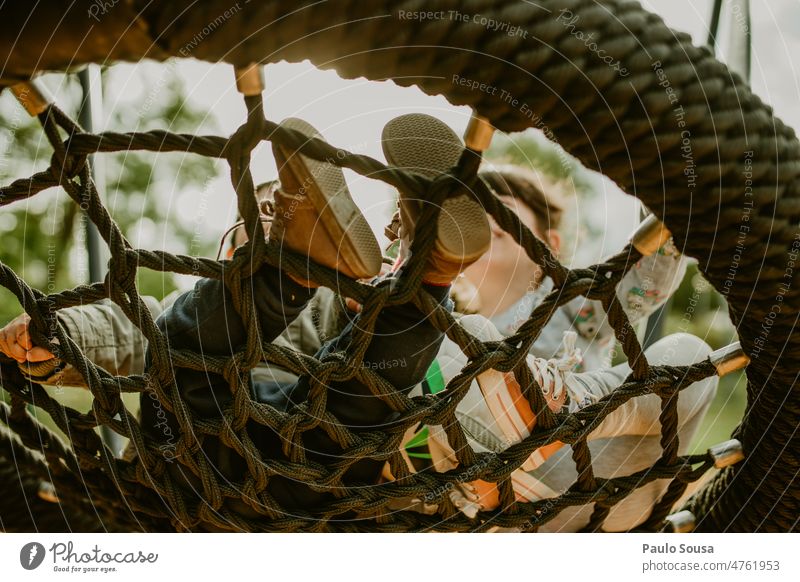 Children playing on playground Brothers and sisters Together childhood Playground playground equipment Life Children's game Leisure and hobbies Exterior shot