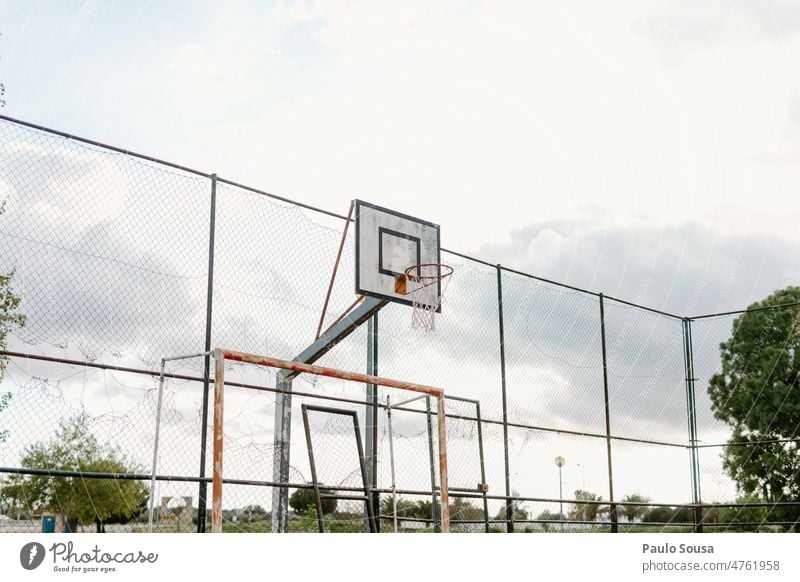 Old rusty basketball hoop against the sky Basket Basketball Basketball basket Sports Playing court Exterior shot game play street sport outdoors playground park