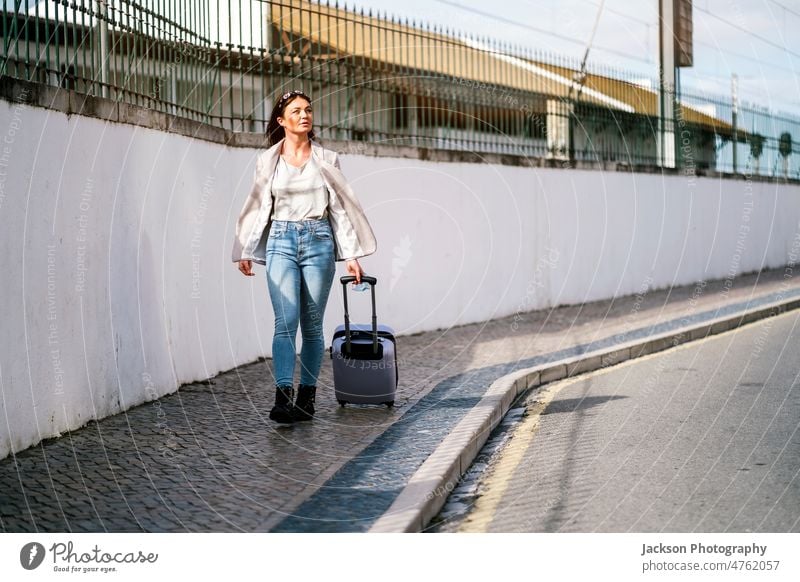 Portrait of traveling woman with luggage in the city covid-19 medical protective pandemic mask explore student businessperson adventure traveler transportation