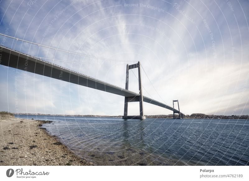 Long bridg linking two citites in Denmark reflection violet blue architecture crossing area sunlight outdoor vertical urban concrete scenery beach fyn