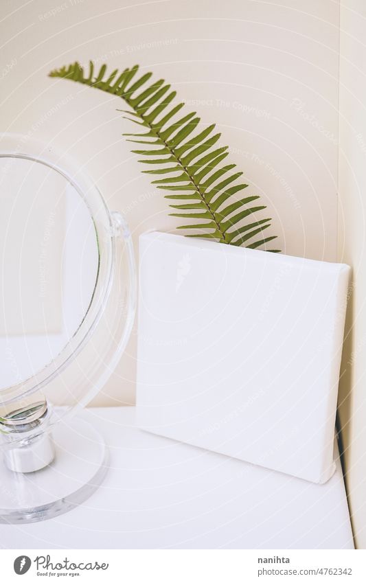 Clean and natural mockup in green and neutral tones mock up canvas leaf fern clean white blanket negative space copy space mirror reflection composition design