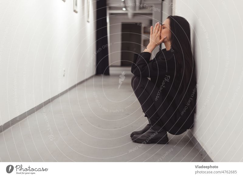 Stressed overworked young business woman sitting on floor. Fired and depressed in office. fired depression stressed caucasian female problem adult sad girl