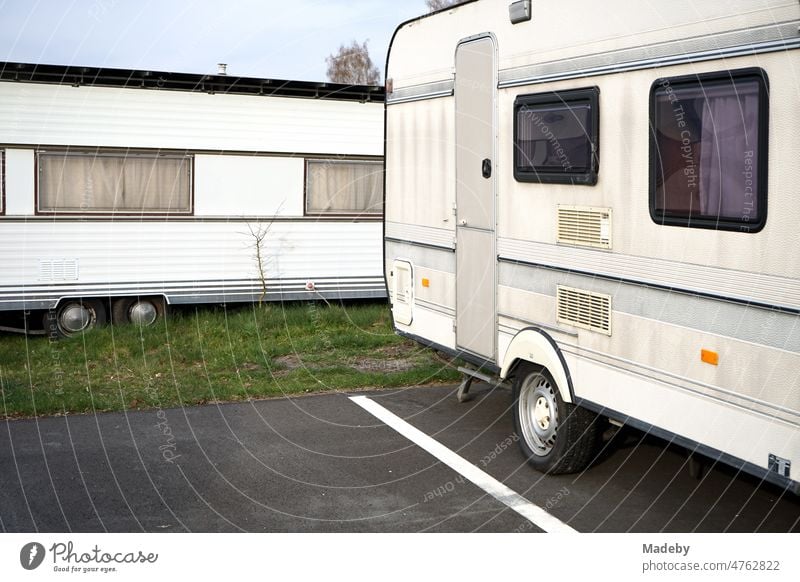 Caravans in beige and natural colors for camping and vanlife on the campsite at the glider airfield in Oerlinghausen near Bielefeld on the Hermannsweg in the Teutoburg Forest in East Westphalia-Lippe