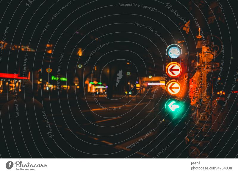 Bicycle traffic light lights all colors at the same time Traffic light Arrow Green Yellow Red Left Turn off Street Pictogram Cycling Transport Town Berlin