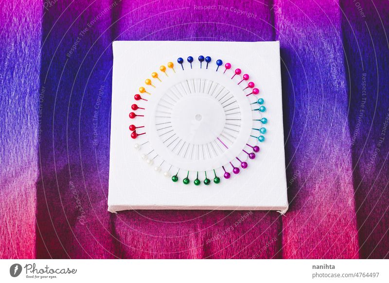 close up of a Rainbow and colorful circle made by pins rainbow haberdashery needle diversity variety vibrant brilliant round new arts and crafts couture sewing