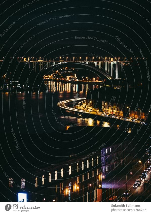 Porto with lights at night with Douro river Bridge River Night shot ponte da arrábida Portugal Europe Town urban farsightedness City trip Curved twisted clearer