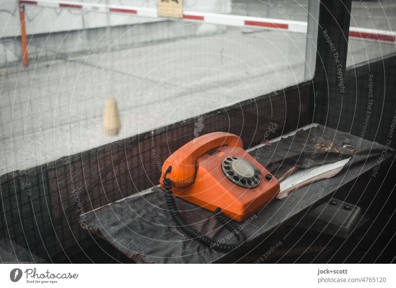 lost porter with phone in orange GDR Telephone Orange gatehouse Rotary dial Old fashioned lost places Design Past Classic Style Pane gatekeeper's lodge