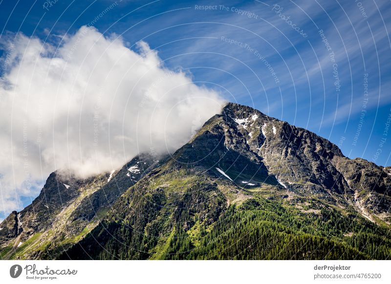 Mountain top in the sun and with cloud in Engadin mountains Top of the mountain Mountaineering White Blue Freedom Clouds Cloud formation Hiking Deserted Nature