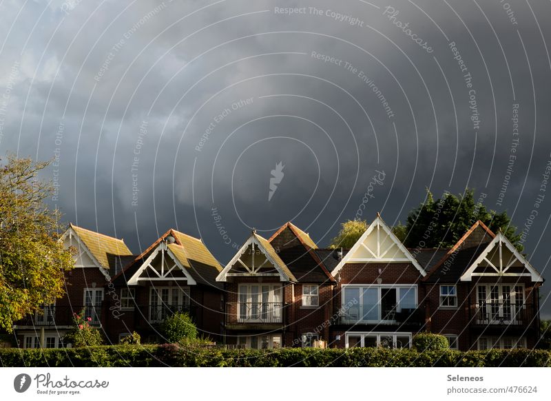 Calm before the storm Environment Nature Sky Clouds Storm clouds Autumn Plant Tree Threat Dark House (Residential Structure) Apartment Building Housefront