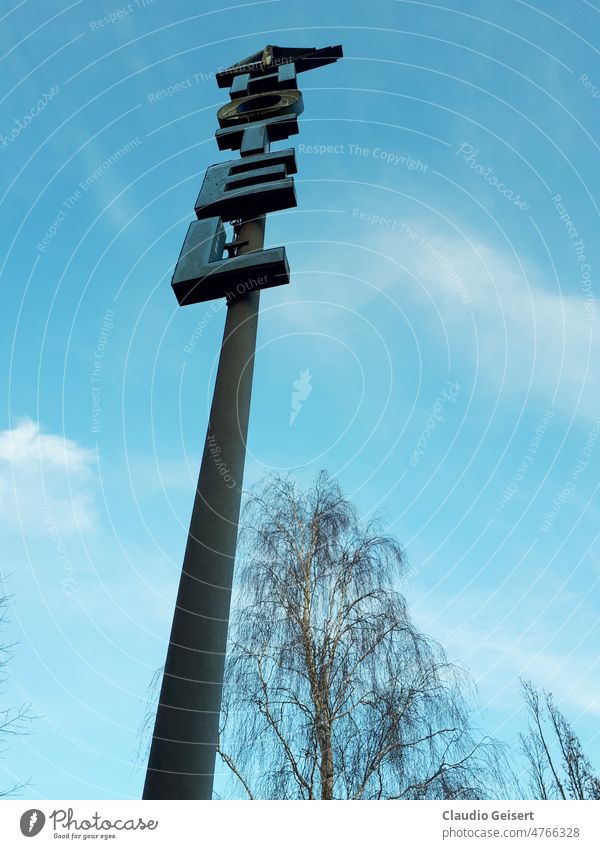 Freestanding pole with hotel lettering Pole Hotel Sky Exterior shot Blue sign