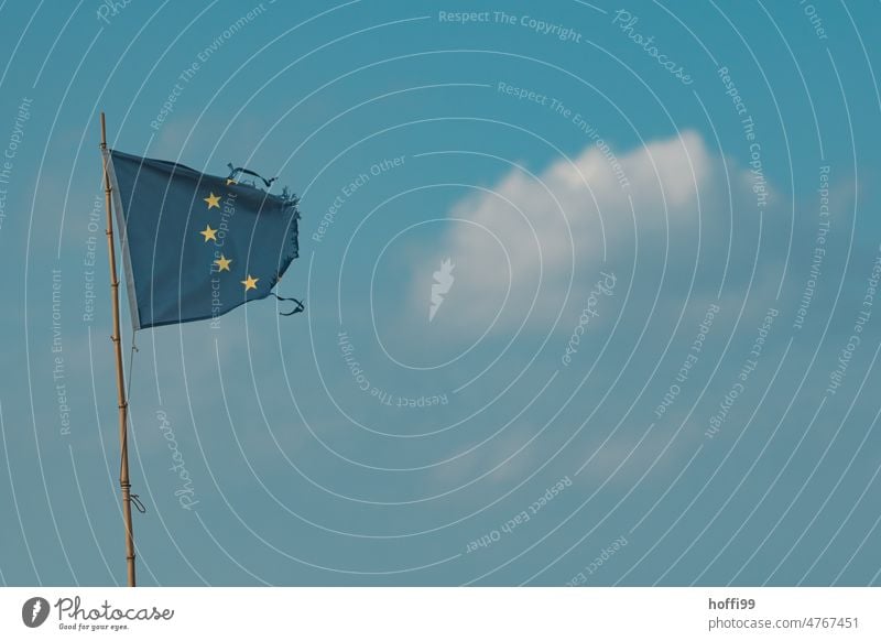 tattered Europe flag in the wind European flag posted brexite decay break break in two Blue Flag Star (Symbol) Landmark Yellow Symbols and metaphors