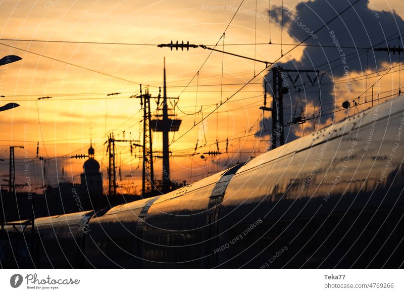 Evening train Train Sun Clouds Town Cologne db German Railway Germany NRW Evening sun Sunset