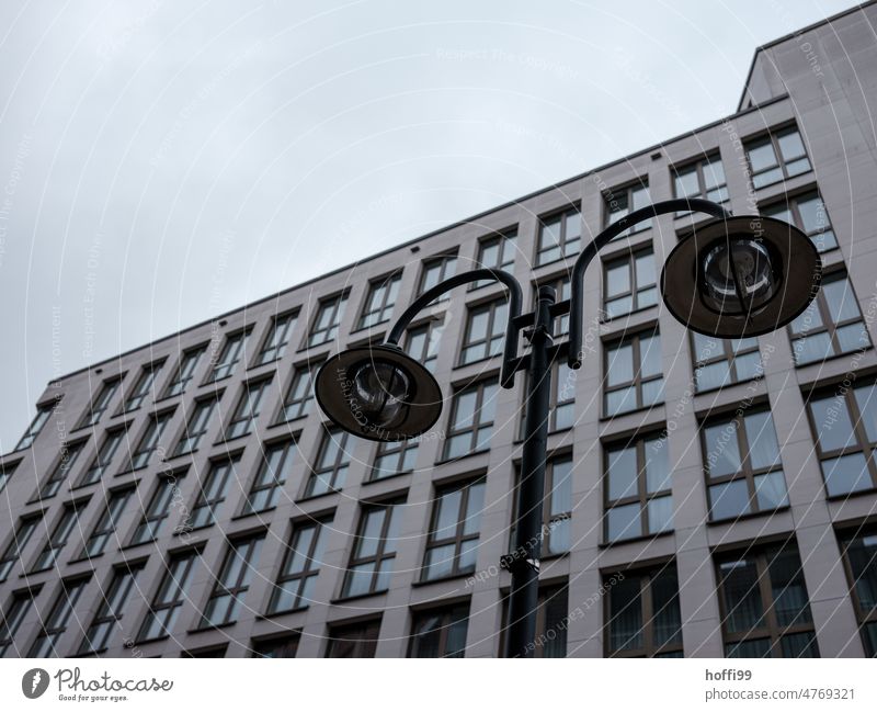 diagonal view of exterior facade of modern residential building with street lighting Modern architecture Street lighting Exterior Facade Balcony Cloudless sky