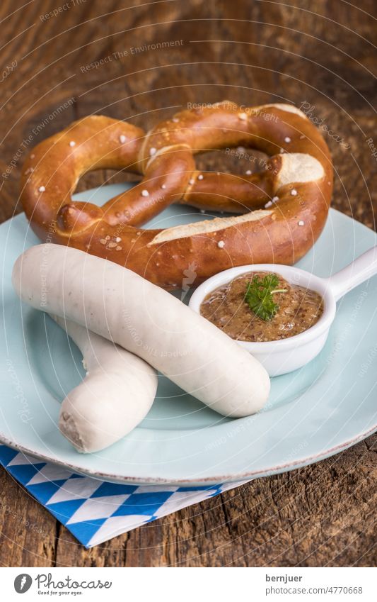 Pair of Bavarian veal sausages White sausages Veal sausage Wood hacked Couple snack two plank cute Breakfast traditionally Eating Munich nobody Pretzel Mustard