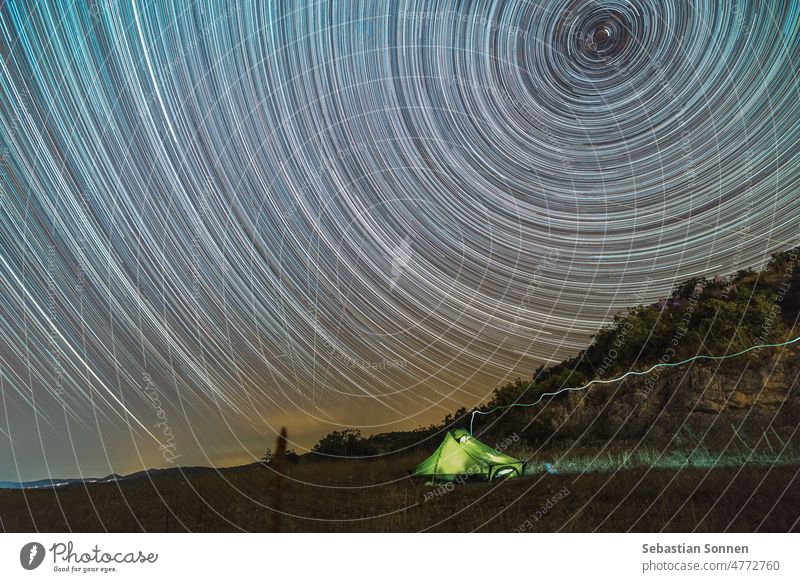 Star trails around polar star above illuminated tent in rocky landscape in Croatia Night Stars Sky Landscape Tent Nature Light Adventure North Storage Evening