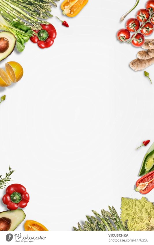 Various vegetables frame with bell pepper, asparagus, tomatoes, ginger, lemon, avocado and chili. Healthy food various healthy food background white background