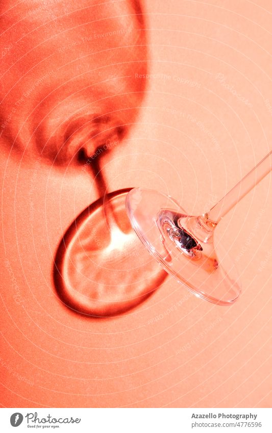 Minimalist still life, wine glass on red background with creative shadow. abstract alcohol art bar beverage blood bordeaux burgundy cabernet celebration