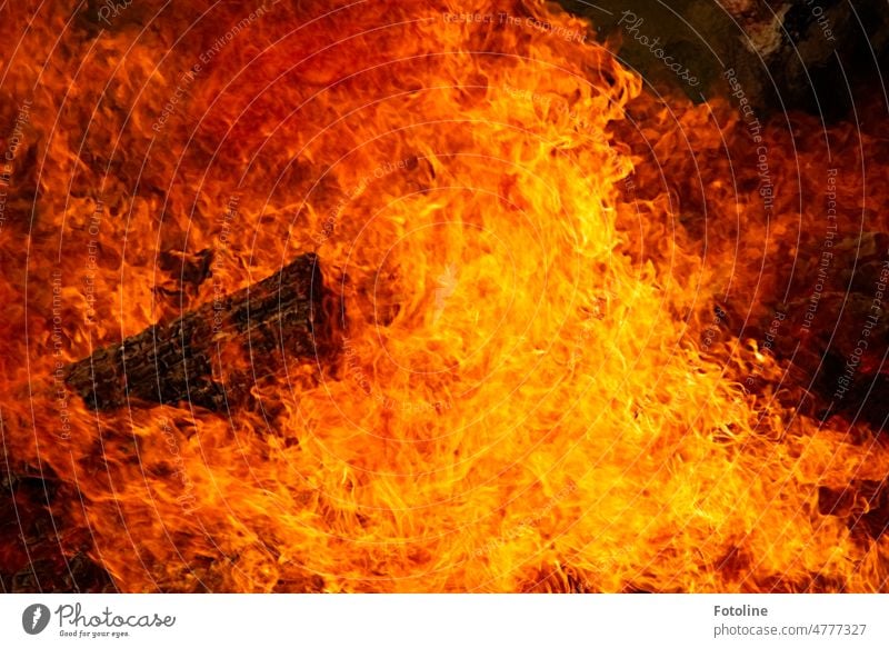 Blazing inferno - A tree trunk is engulfed in flames during an Easter bonfire. Fire Blaze Burn Flame Hot Warmth Yellow Night Orange Light Wood Black