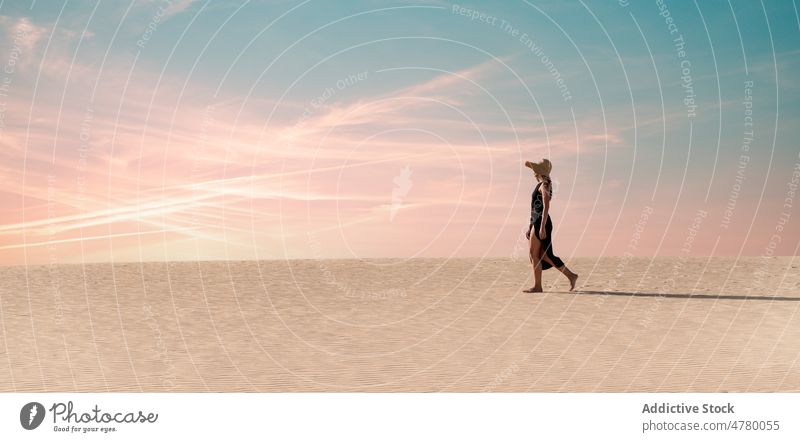 woman walking on sandy dune in sunset summer beach sundown sky heaven female fuerteventura corralejo dunes canary islands spain nature dusk evening freedom