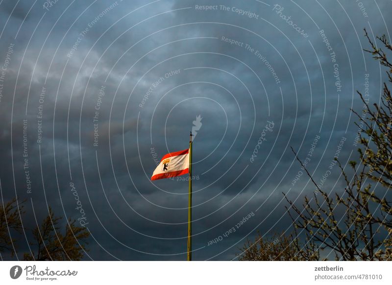 Berlin flag City coat of arms Berlin Bear Germany Flagpole Clouds Capital city emblem Menacing Thunder and lightning nation Nationality Skyline City trip Scene