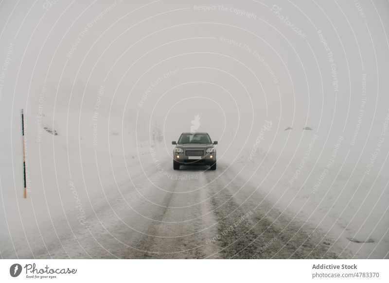 Car driving on snowy road car drive winter countryside hoarfrost speedway road trip automobile cold fog weather vehicle route frozen straight nature transport