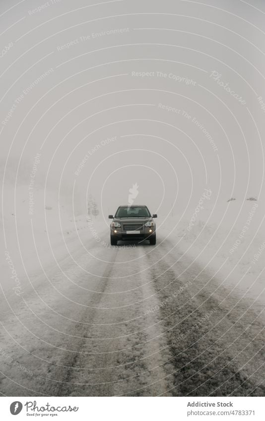 Car driving on snowy road car drive winter countryside hoarfrost speedway road trip automobile cold fog weather vehicle route frozen straight nature transport