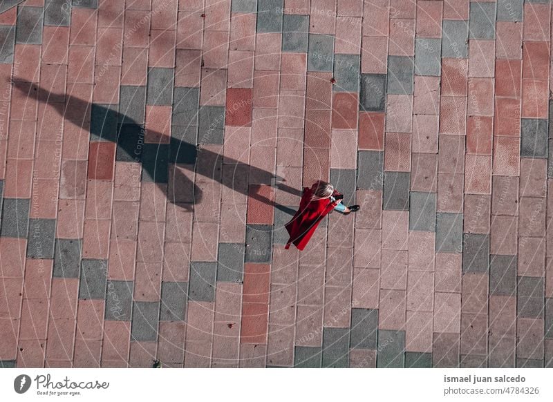 woman walking around the street in Bilbao city, spain tourist tourism person people human pedestrian shadow silhouette ground outdoors urban city life lifestyle