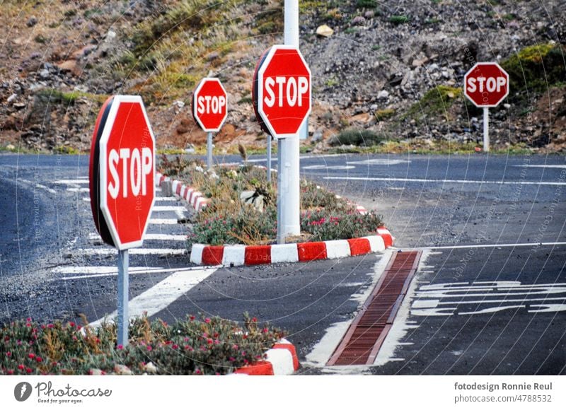 Several stop signs at a traffic circle Reddish white Clue Signal Hexagon Stop line Traffic circle Exterior shot Landscape format color picture