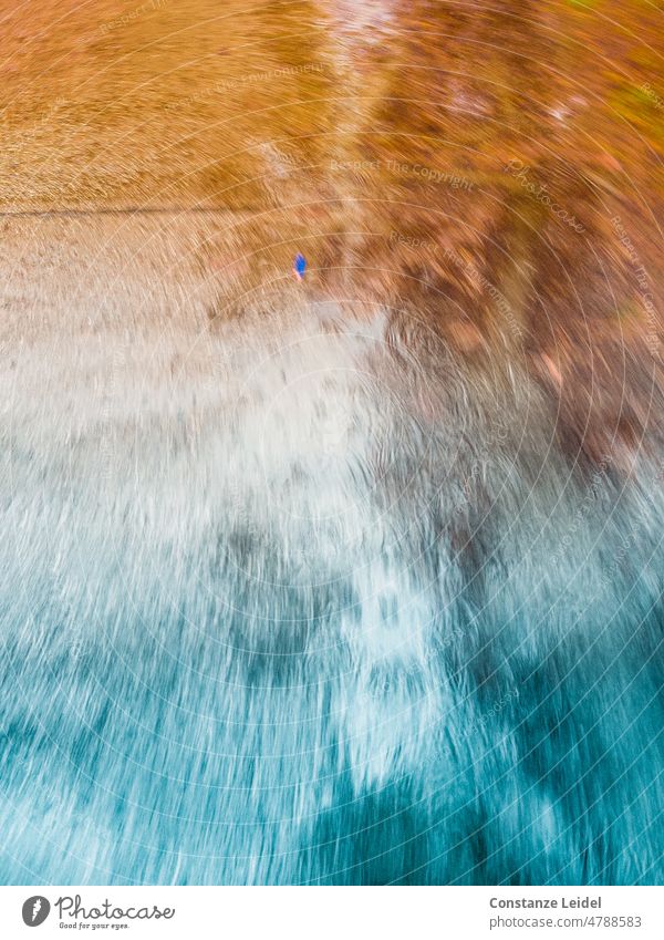 Smudged raindrops in orange and turquoise with small blue spot. Structures and shapes Street Blue Orange Patch blurred Abstract Deserted Pattern Colour photo