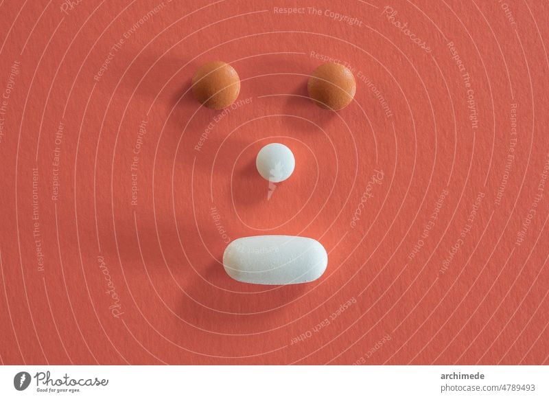 Face made with different pills antibiotic aspirin capsule care chemical closeup disease drug face flu headache health healthcare healthy icon illness immunity