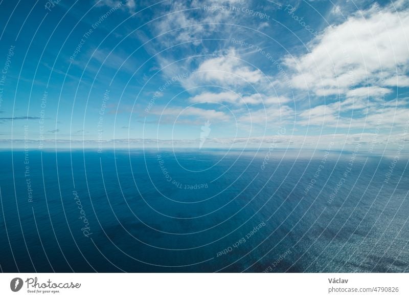 View from the Cabo Girao lookout, the highest cliff in Madeira, of the city of Funchal and the Atlantic Ocean. Aerial view in sunny weather on pure nature